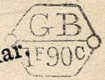 Marque hexagonale avec cercles aux bouts, lettres GB et valeur