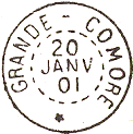 Timbre  date circulaire avec fleuron et mention : GRANDE COMORE